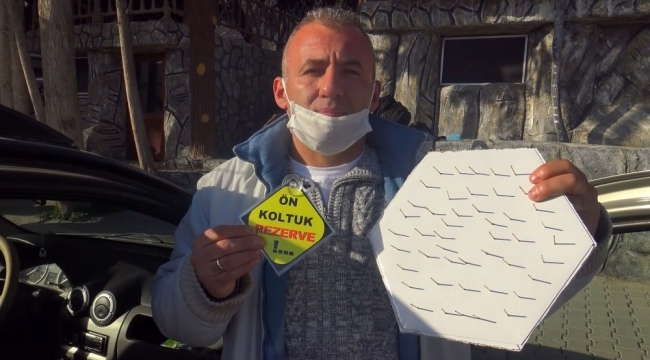 Ön koltuğa oturmasınlar diye çivilerle 'korona savar' yaptı