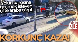 Yoldan karşıya geçmek isteyen çifte araba çarptı; o anlar kameraya yansıdı